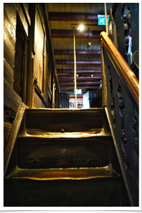 Stairs up to third floor where storage and dock workers roomed.